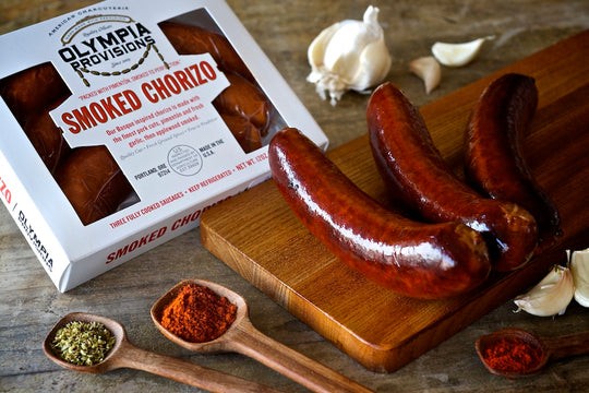 smoked chorizo in a package and laid out on a small charcuterie board