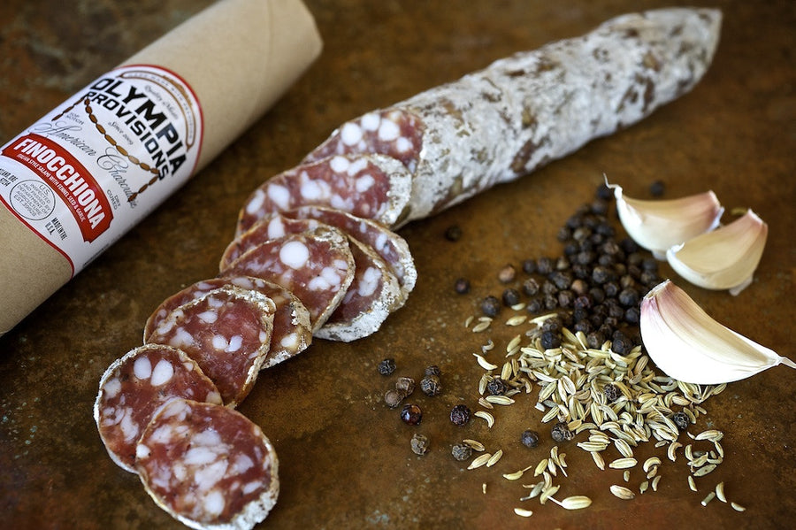 Olympia Provisions traditional Italian style Finnocchiona sausage sliced up for a charcuterie board