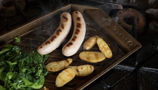 charcuterie board with grilled bratwurst, rapini and fingerling potatoes