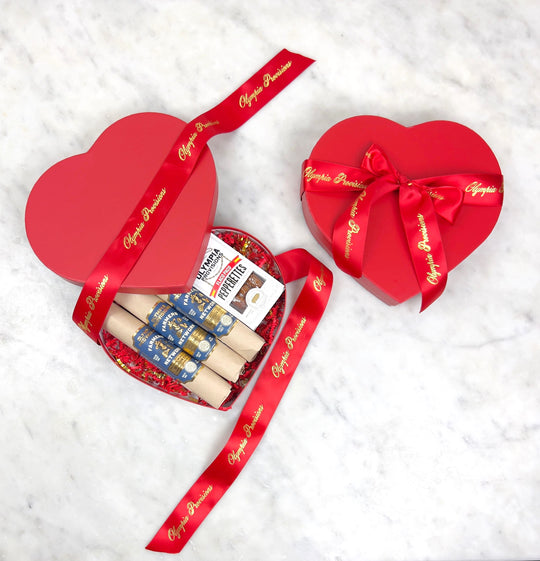 Red heart gift box filled with Olympia Provisions Farmer Network Salami and Flaco Paco