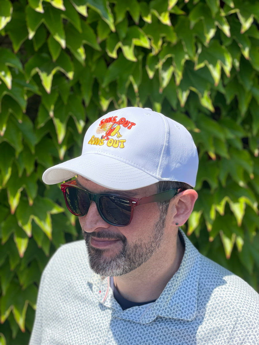 Man wearing suns out buns out hat