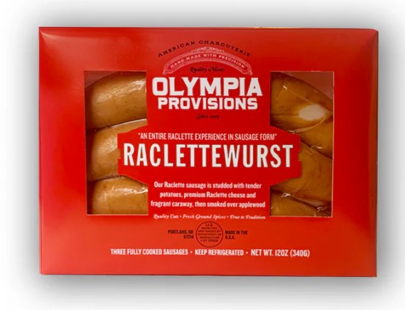 Red packaging of Olympia Provisions Raclettewurst with visible text and images of sausages.