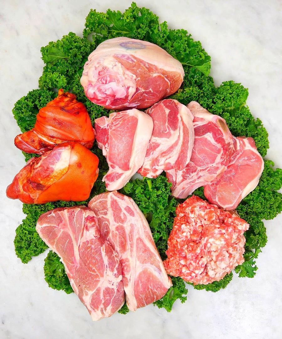 Pasture raised pork on a bed of kale