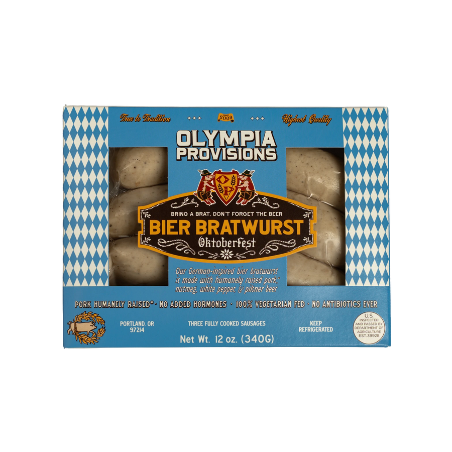 One pack of Olympia Provisions Bier Bratwurst containing three links of sausage, packages in a blue box with white and blue diamond accents.