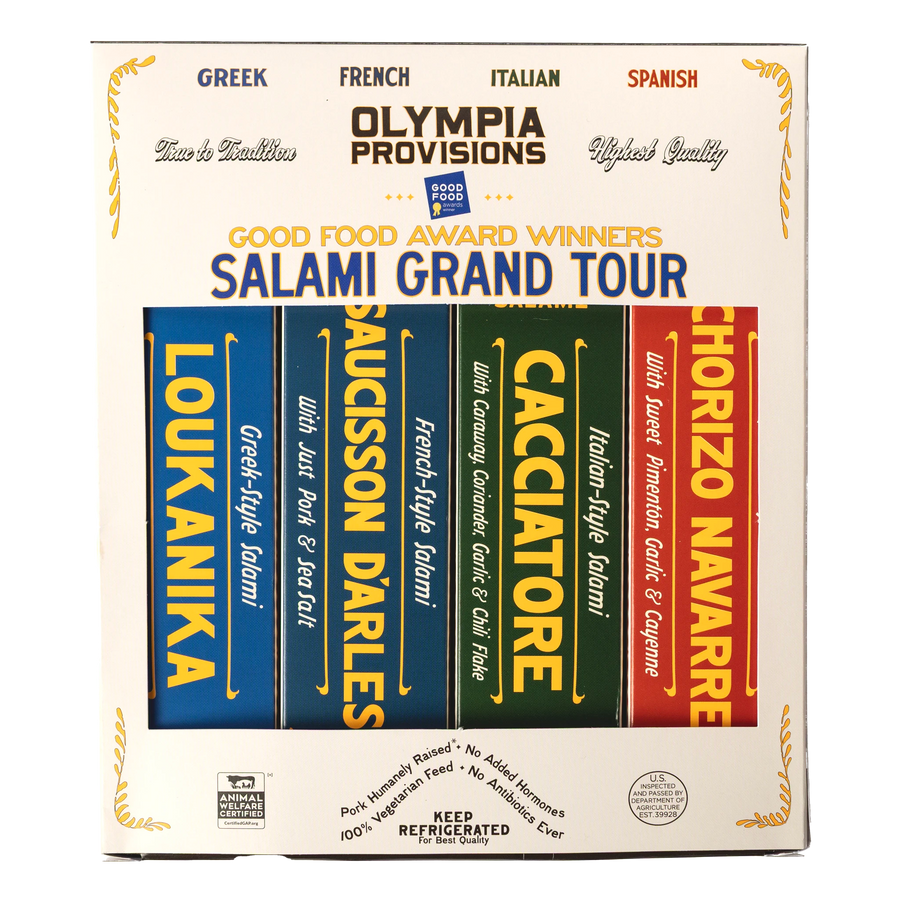 Four Olympia Provisions European-inspired salamis in boxes, packed in a cream box labelled "Good Food Award Winners Salami Grand Tour"