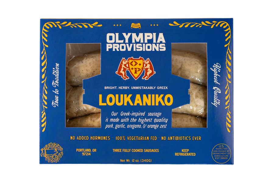 Olympia Provisions Loukaniko Sausage with garlic, oregano, and orange zest, packaged in a blue box.