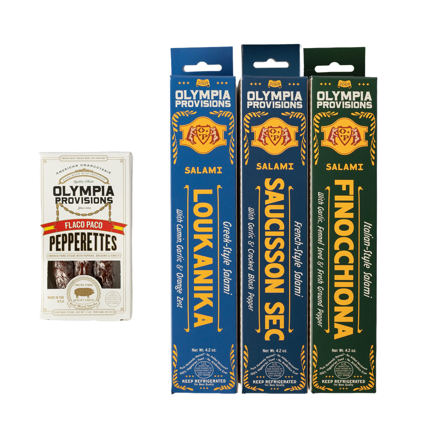 Olympia Provisions Loukanika, Saucisson Sec, and Finocchiona salamis in boxes, and Flaco Paco pepperettes.
