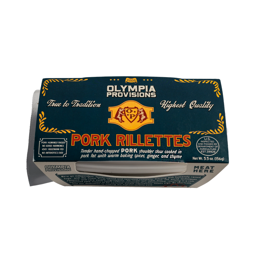 Olympia Provisions Pork Rillettes with warm baking spices, ginger, and thyme, in blue packaging.