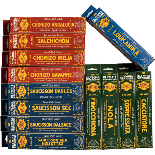 Twelve assorted Olympia Provisions salamis in French, Spanish, Greek, and Italian varieties.