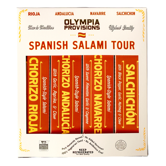 Four Olympia Provisions Spanish-inspired salamis in red boxes, packed in a cream box labelled "Spanish Salami Tour"