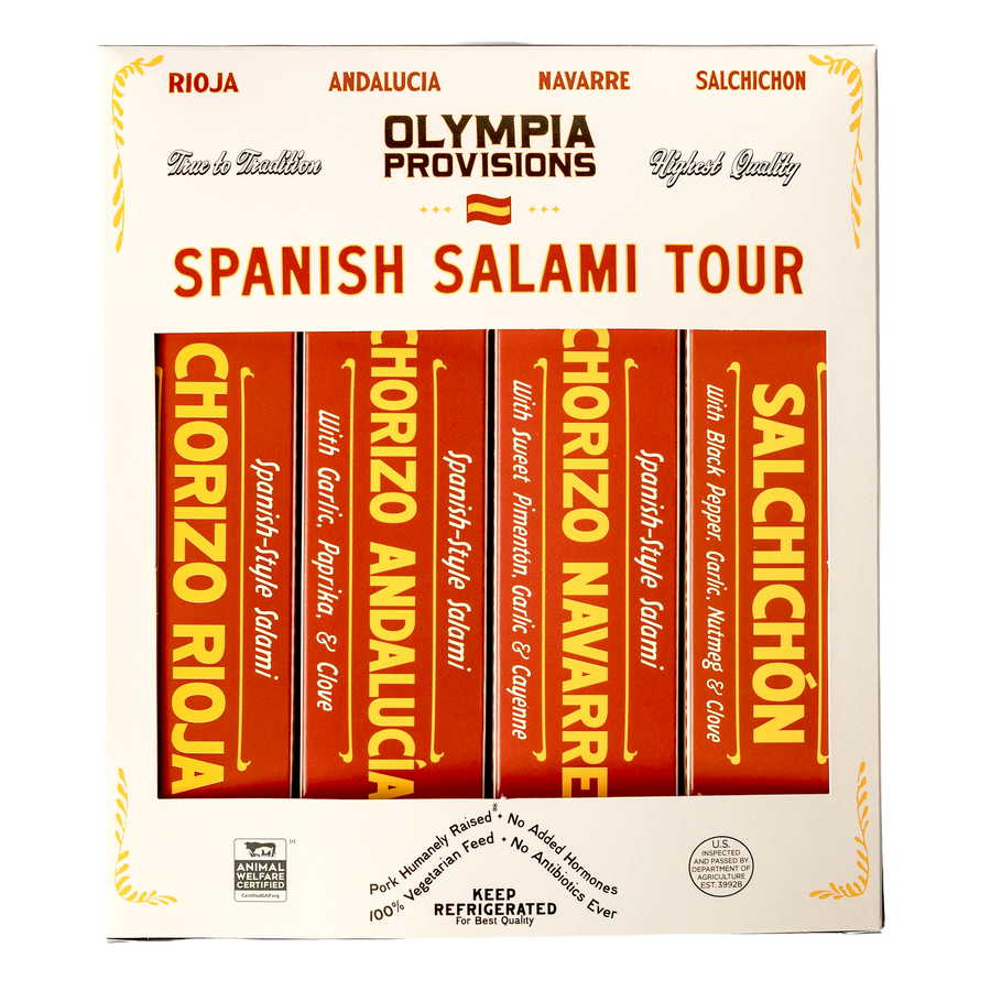 Four Olympia Provisions Spanish-inspired salamis in red boxes, packed in a cream box labelled "Spanish Salami Tour"