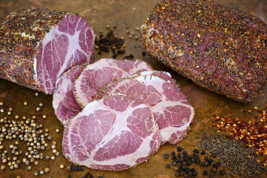 sliced Olympia Provisions Capicola, gabagool, meat covered in spices