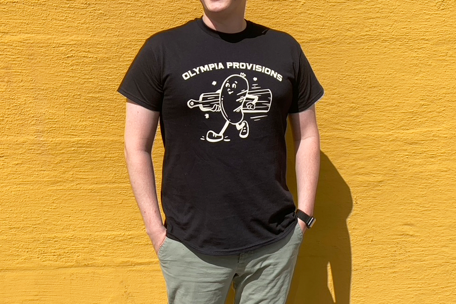 Person wearing an Olympia Provisions Sausage tee