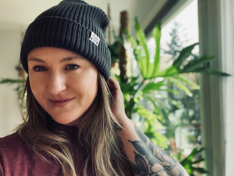 woman wearing Olympia Provisions beanie