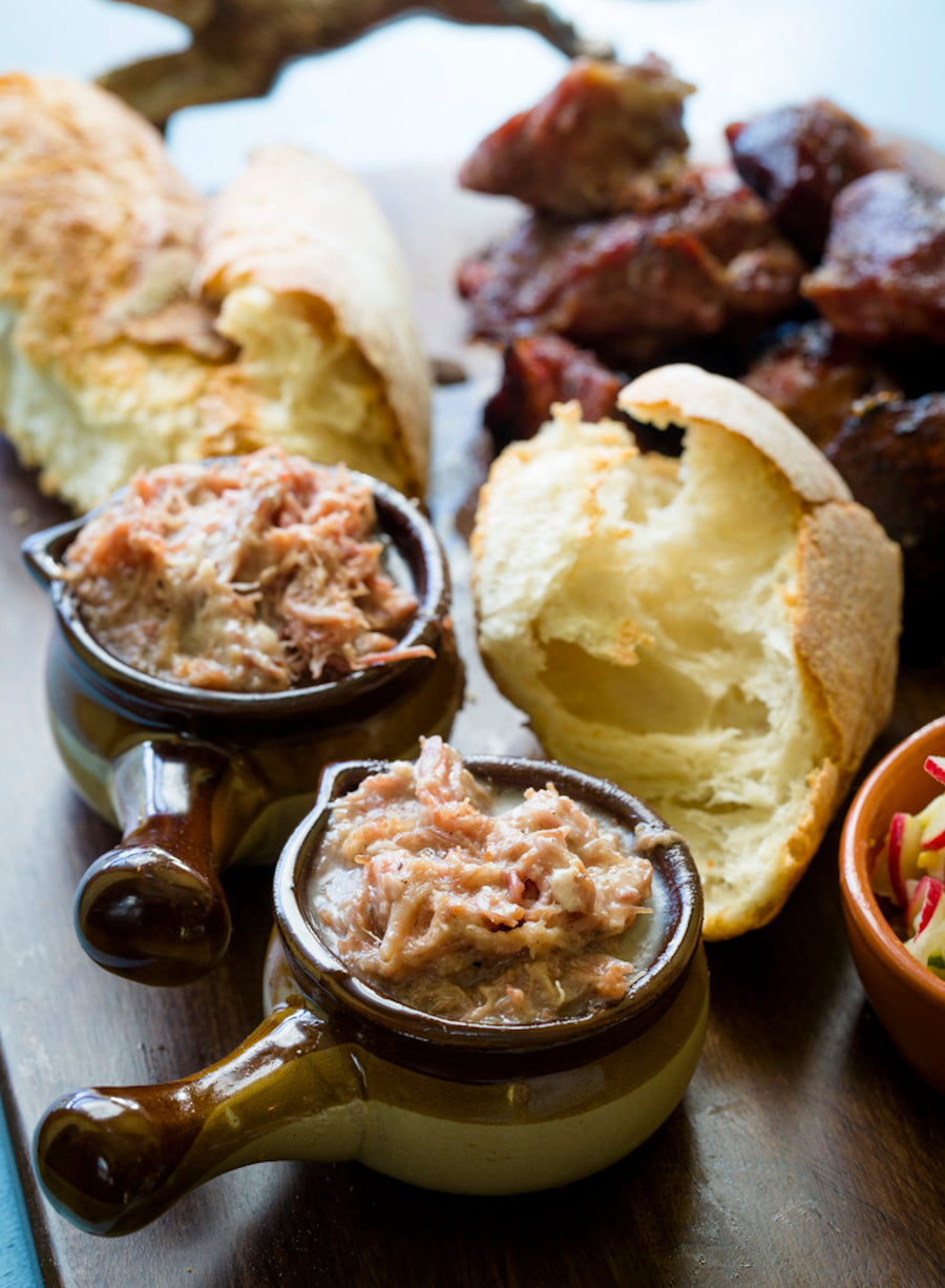 rillettes, bread on a wood cutting board